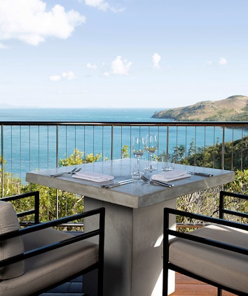 qualia resort golf clubhouse lunch table set up on balcony with Whitsundays views