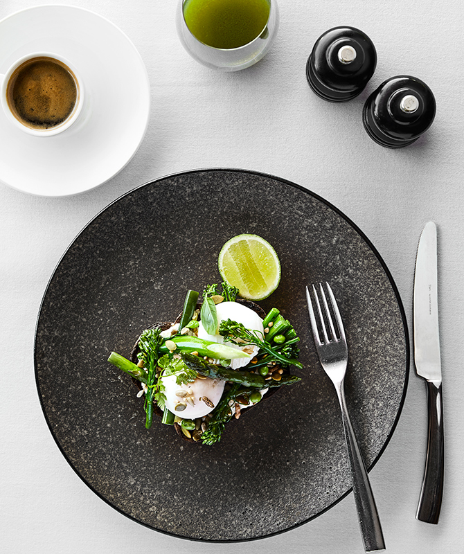 qualia resort breakfast table setting at Long Pavilion restaurant with poached eggs and coffee 