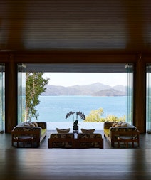 Entrance to qualia resort Long Pavilion restaurant with lounge area and Whitsundays views