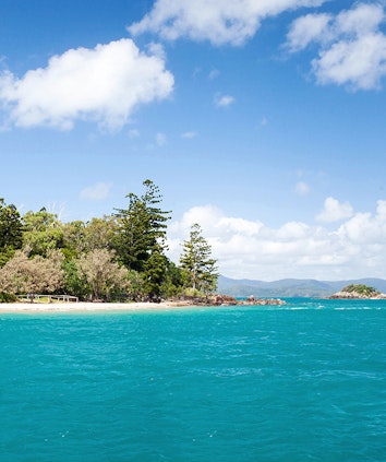 Beach and turquoise Whitsundays waters as part of qualia resort experience of Beach Drop Off