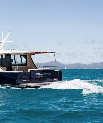 qualia resort experience of luxury motor boat named Palm Beach making waves in the Whitsundays water