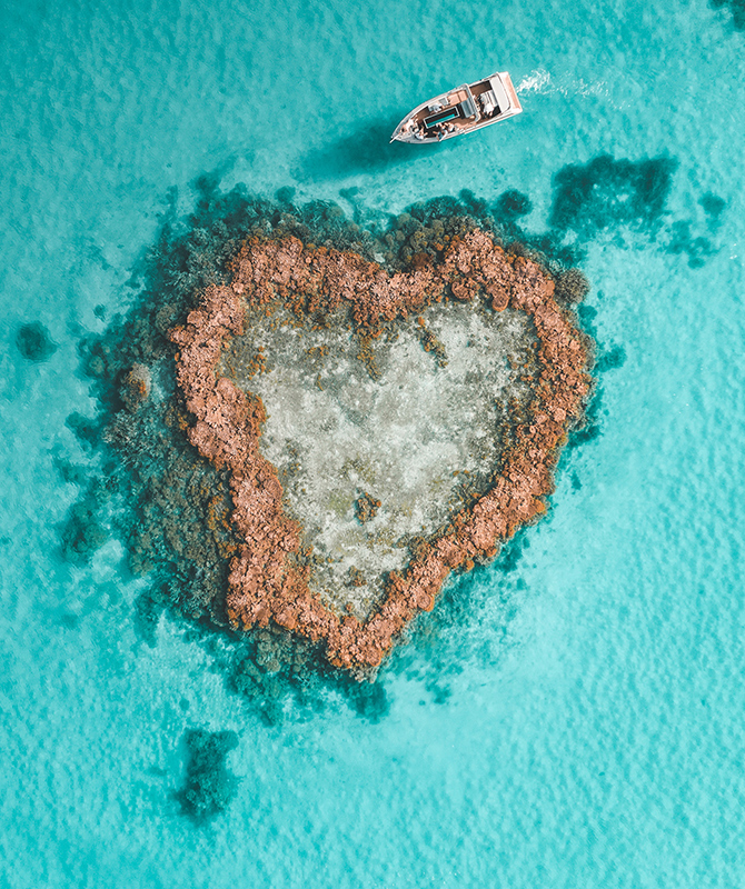 Aerial view of Hamilton Island Heart Pontoon and Heart Island in Heart Reef in the Great Barrier Reef
