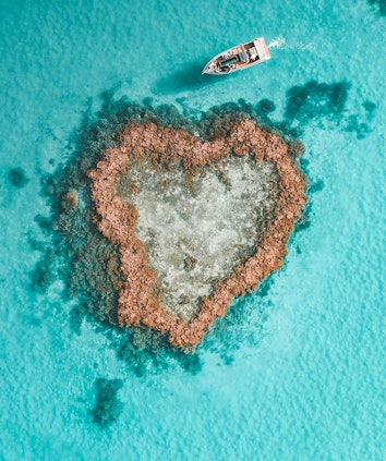 Aerial view of Hamilton Island Heart Pontoon and Heart Island in Heart Reef in the Great Barrier Reef