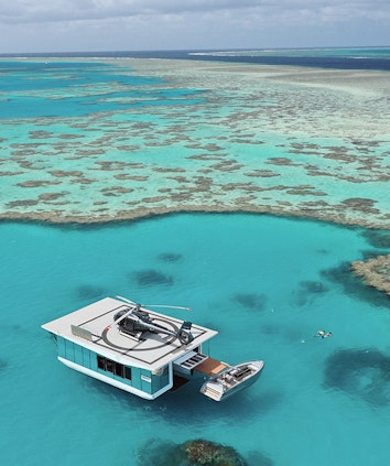 qualia experience of Journey to the Heart featuring luxury pontoon near Heart Island in Great Barrier Reef