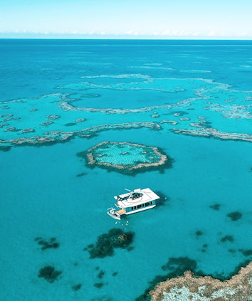 qualia experience of Journey to the Heart featuring luxury pontoon near Heart Island in Great Barrier Reef