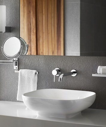 Bathroom sink, chrome tapware and mirror at qualia resort's Leeward Pavilion Bathroom