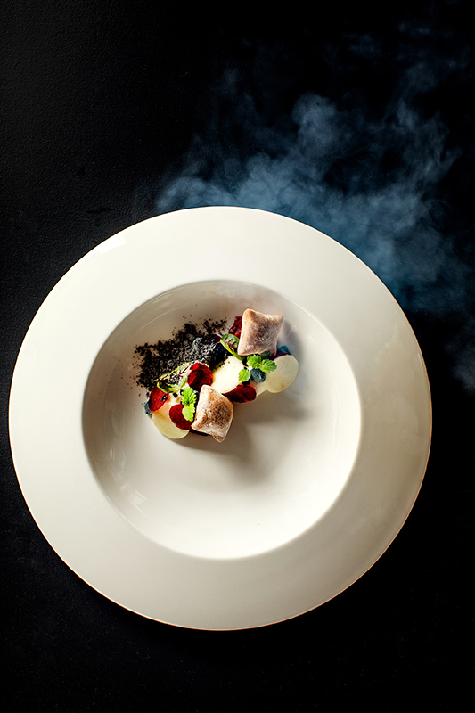 Whitsunday sunset view from dinner tables set outdoor at qualia resort's Long Pavilion restaurant