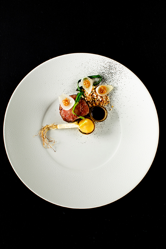 Whitsunday sunset view from dinner tables set outdoor at qualia resort's Long Pavilion restaurant