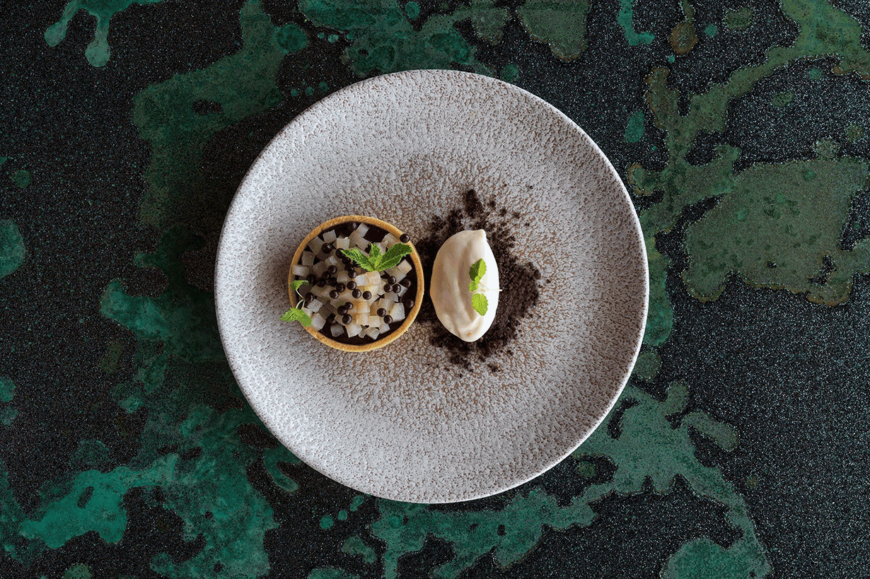 Whitsunday sunset view from dinner tables set outdoor at qualia resort's Long Pavilion restaurant