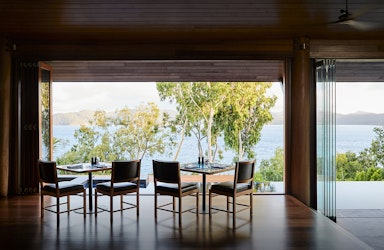 Whitsundays views of breakfast tables set at qualia resort's Long Pavilion restaurant