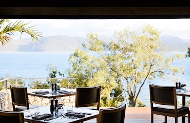 Whitsundays views of breakfast tables set at qualia resort's Long Pavilion restaurant