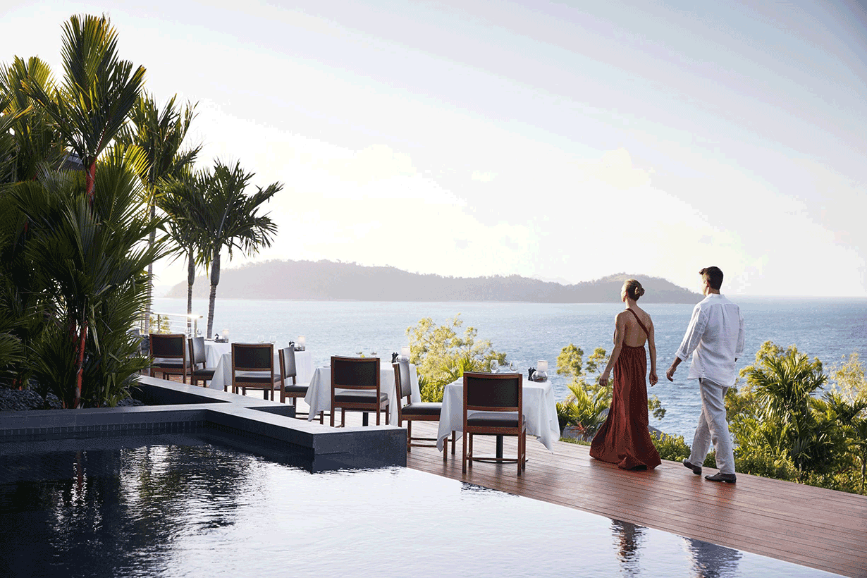Whitsunday sunset view from dinner tables set outdoor at qualia resort's Long Pavilion restaurant