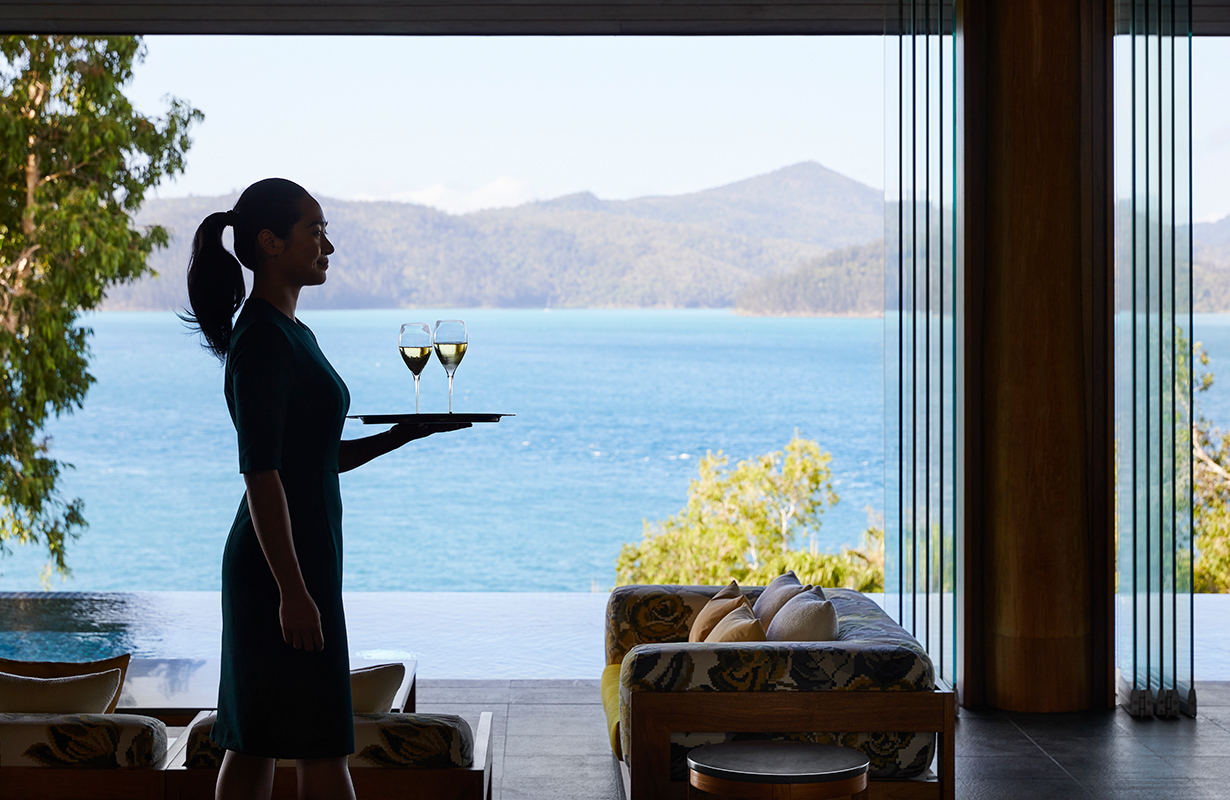 exterior view of qualia resort and surrounding trees from the calm waters of the Whitsundays 