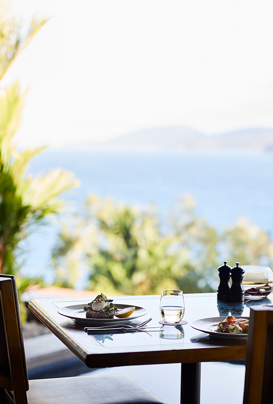 Whitsundays views of breakfast tables set at qualia resort's Long Pavilion restaurant