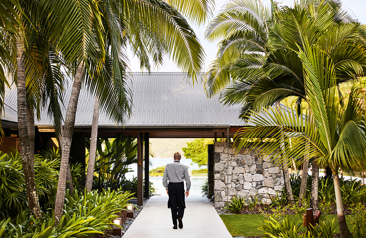 Whitsunday sunset view from dinner tables set outdoor at qualia resort's Long Pavilion restaurant