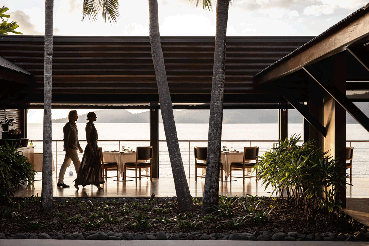 Whitsunday sunset view from dinner tables set outdoor at qualia resort's Long Pavilion restaurant