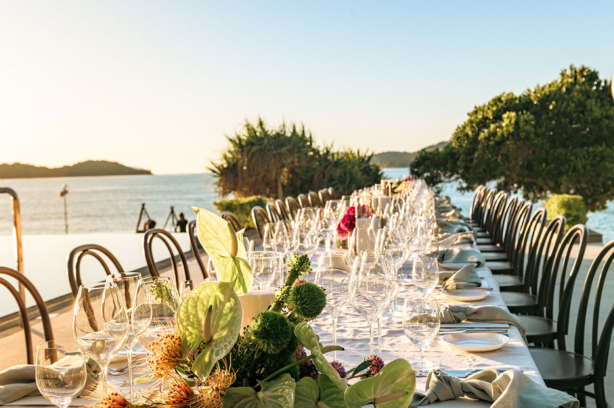 Sailing fleet passage in the turquoise waters of the Whitsundays at Hamilton Island Race Week 