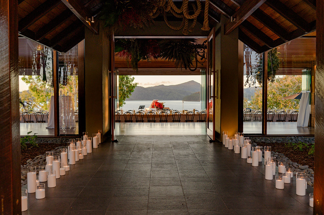 Sailing fleet passage in the turquoise waters of the Whitsundays at Hamilton Island Race Week 
