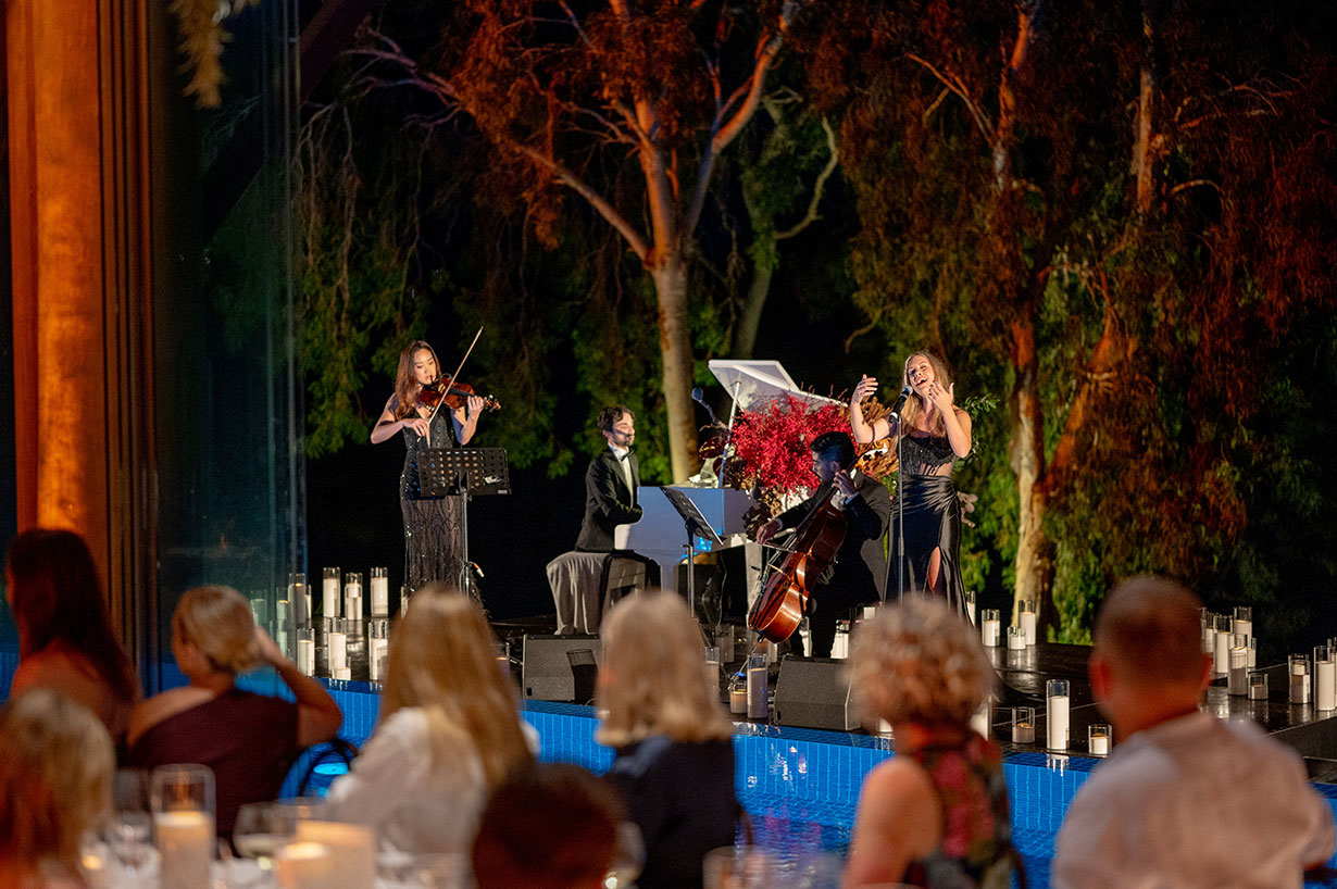 Sailing fleet passage in the turquoise waters of the Whitsundays at Hamilton Island Race Week 