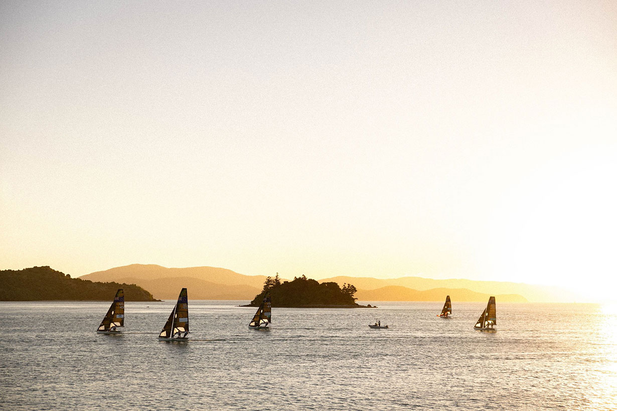 Sailing fleet passage in the turquoise waters of the Whitsundays at Hamilton Island Race Week