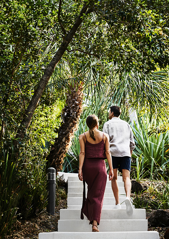 exterior view of qualia resort and surrounding trees from the calm waters of the Whitsundays 