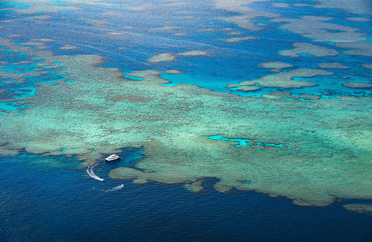 Aerial view of snorkelling and diving boat in Great Barrier Reef as part of qualia resort experience
