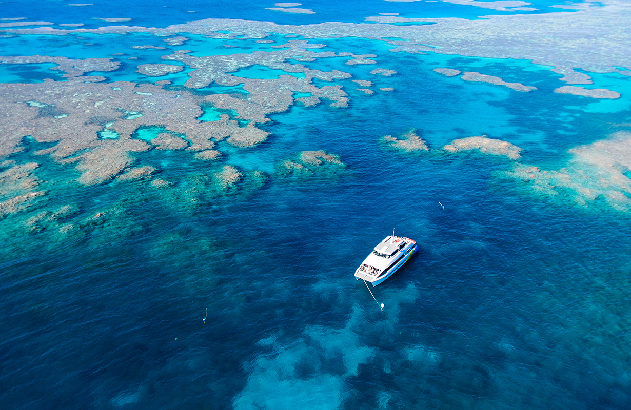 Aerial view of snorkelling and diving boat in Great Barrier Reef as part of qualia resort experience