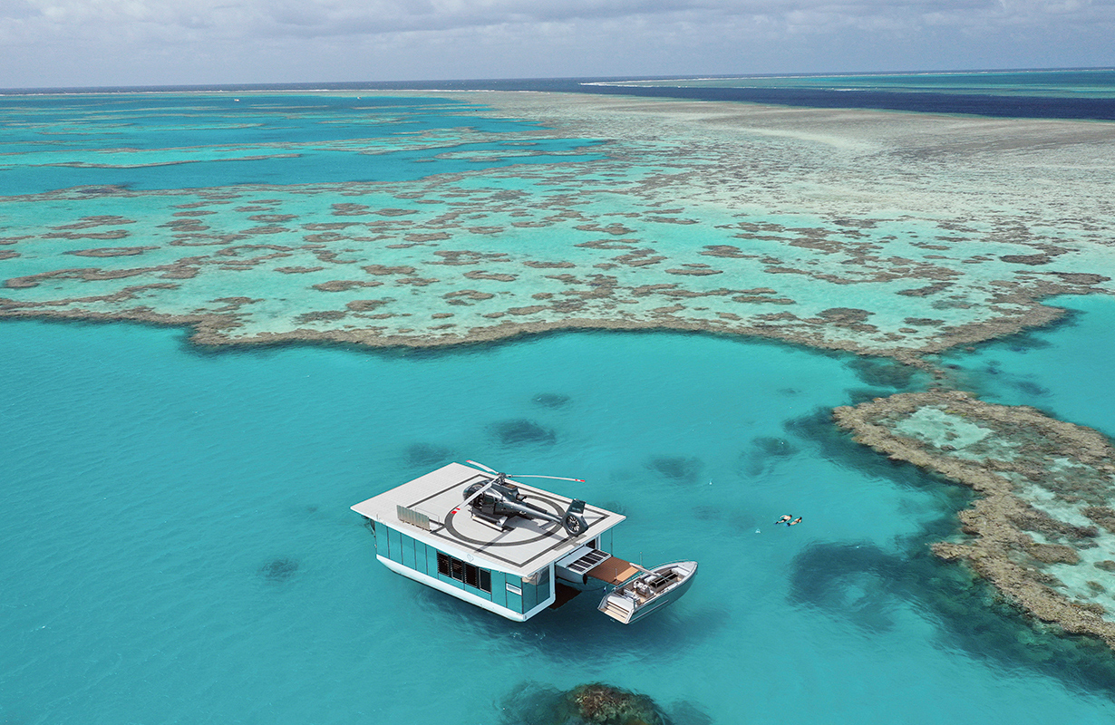 Aerial wide view of pontoon and jet ski during the qualia experience of Journey to the Heart 
