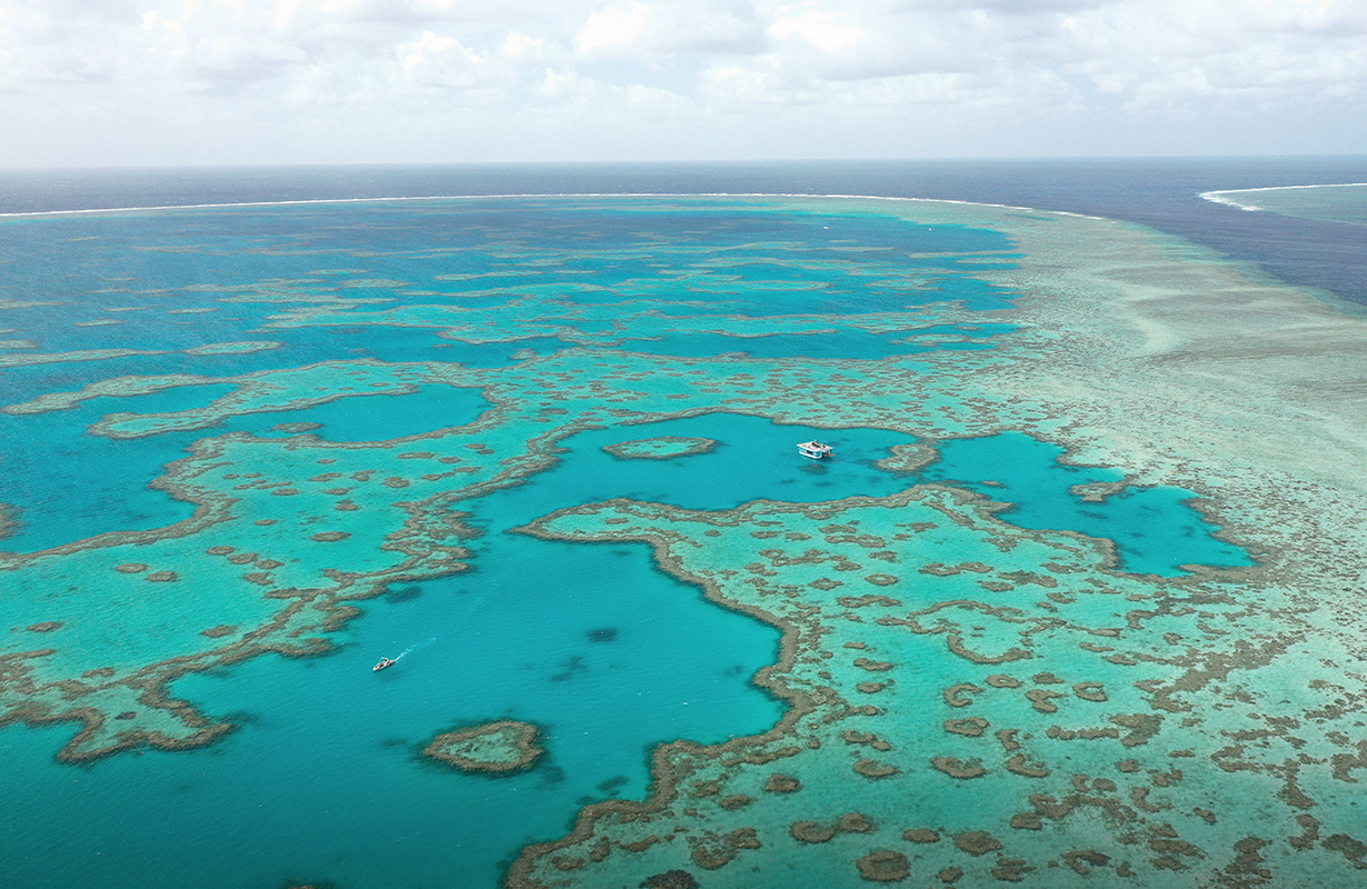 Aerial wide view of pontoon and jet ski during the qualia experience of Journey to the Heart 