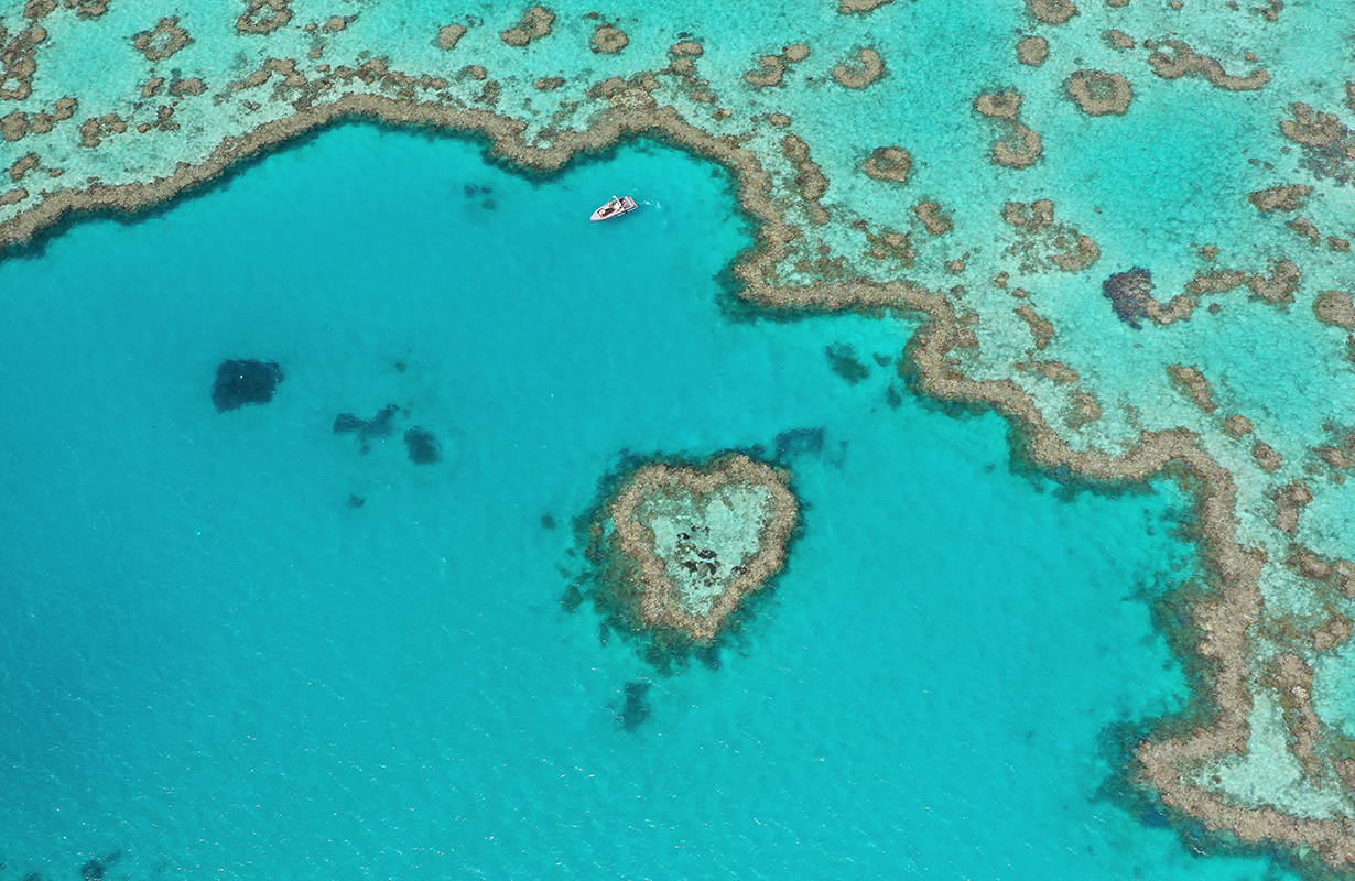 Aerial wide view of pontoon and jet ski during the qualia experience of Journey to the Heart 
