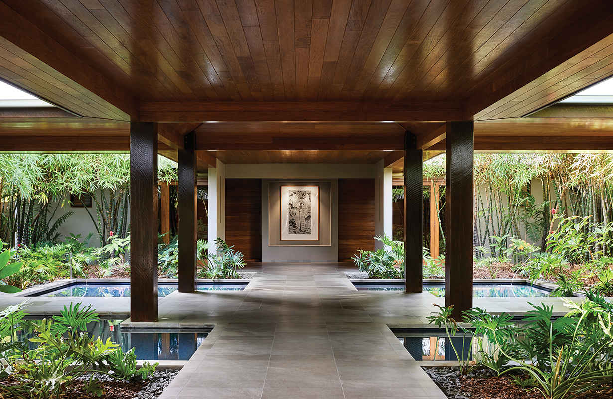exterior view of qualia resort and surrounding trees from the calm waters of the Whitsundays 