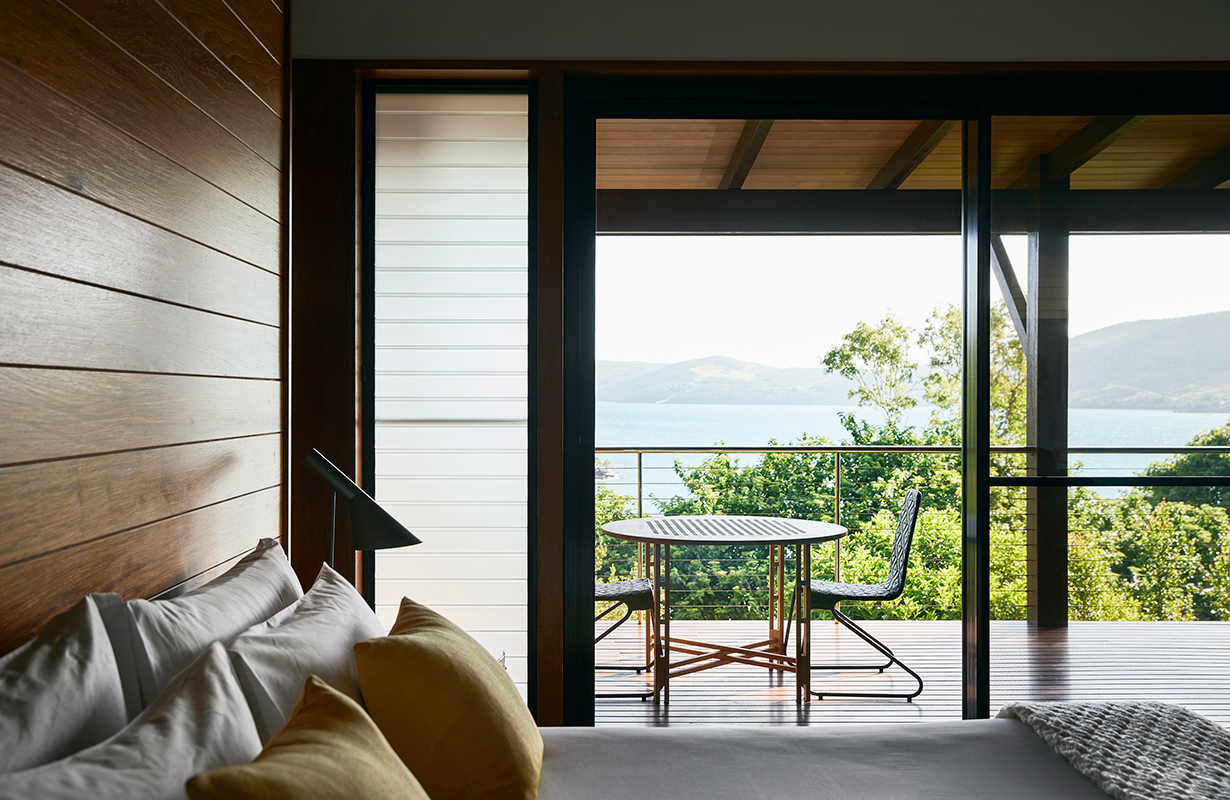 exterior view of qualia resort and surrounding trees from the calm waters of the Whitsundays 