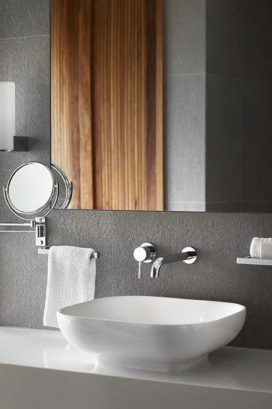 exterior view of qualia resort and surrounding trees from the calm waters of the Whitsundays 