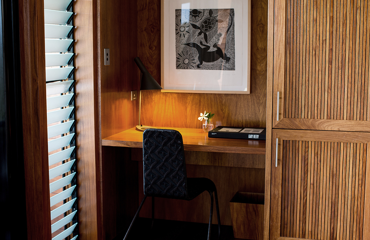 Leeward Pavilion lounge open doors towards private terrace with view of trees and the Whitsundays