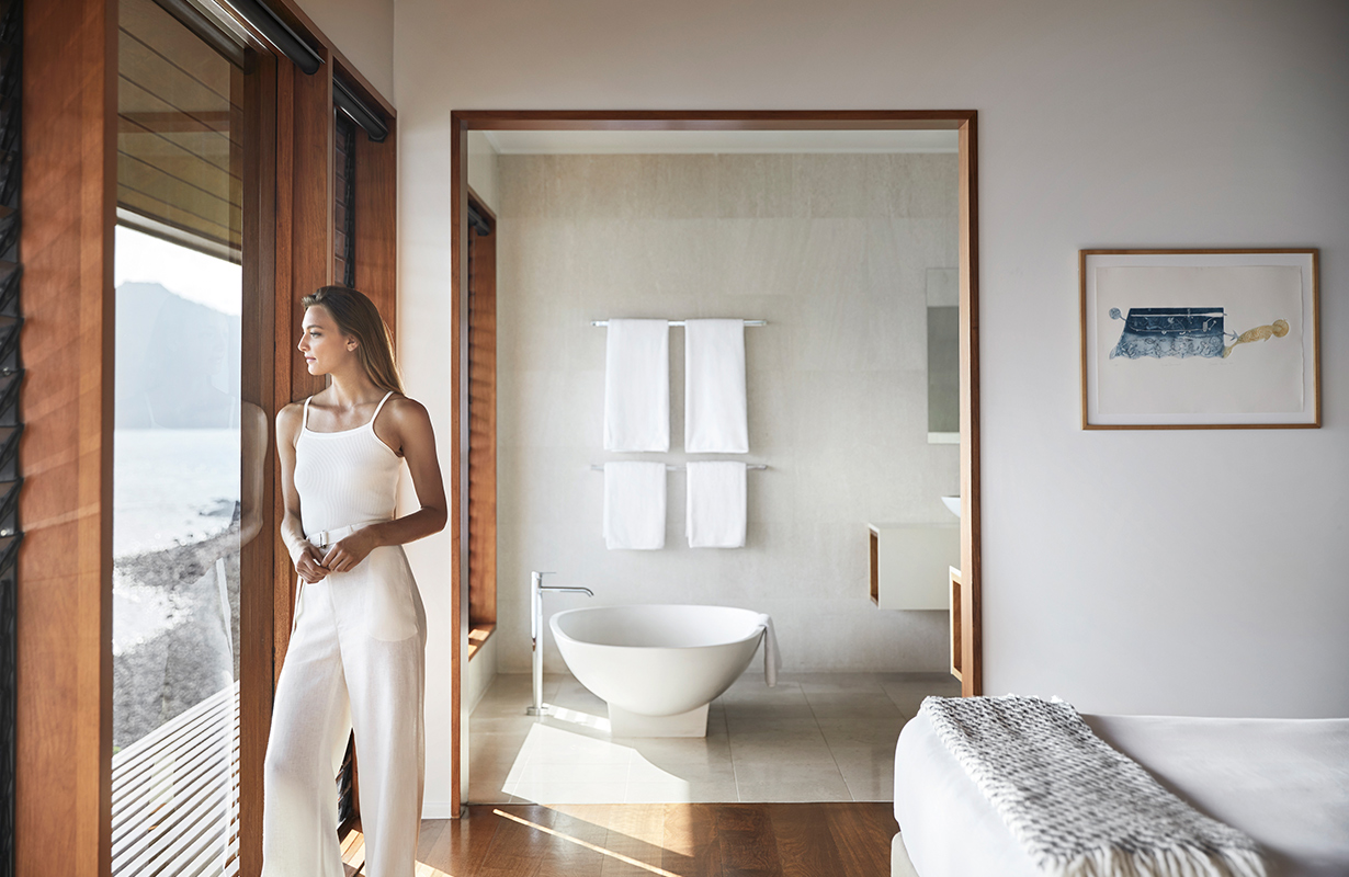 exterior view of qualia resort and surrounding trees from the calm waters of the Whitsundays 