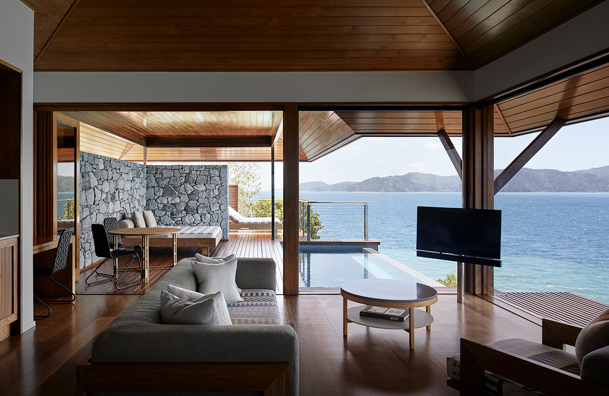 View of private deck with plunge pool and the Whitsundays from inside Windward Pavilion lounge