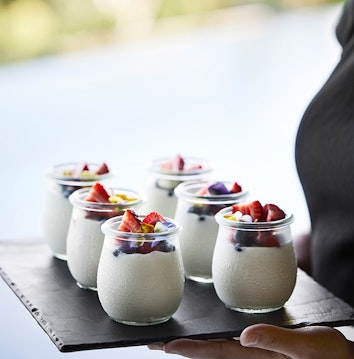 qualia Long Pavilion breakfast service with tray of berry yoghurt glasses