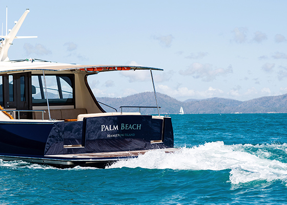 qualia resort experience of luxury motor boat named Palm Beach making waves in the Whitsundays water