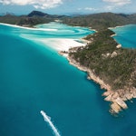 qualia aerial view of boats surrounding Whitehaven Beach and Whitsunday Island