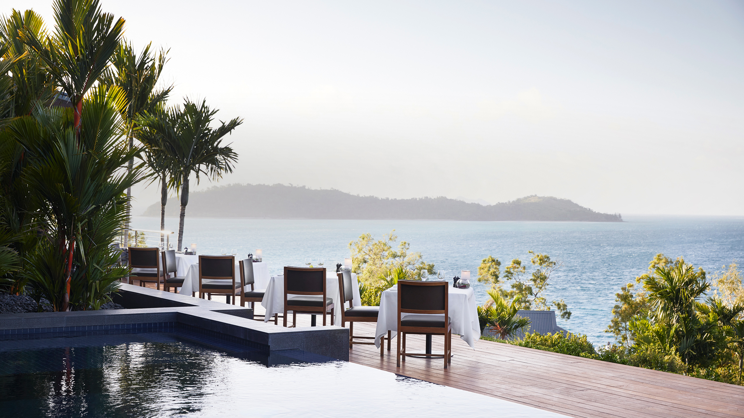 qualia Resort Outdoor Dinner Tables at Long Pavilion Restaurant with Whitsundays Views