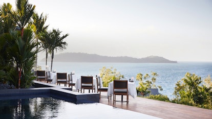 qualia Resort Outdoor Dinner Tables at Long Pavilion Restaurant with Whitsundays Views
