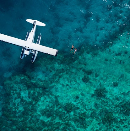qualia aerial view of luxury sea plane landed from scenic flight on a Great Barrier Reef tour